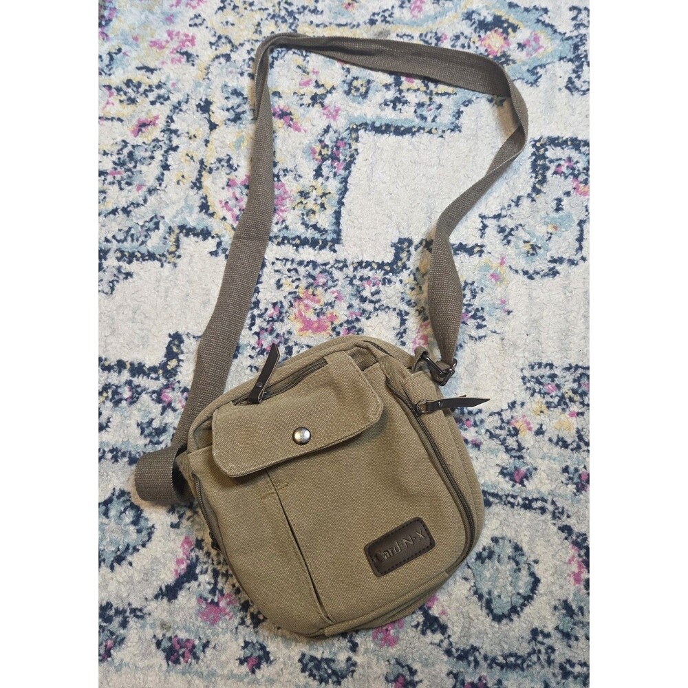 brown canvas crossbody bag Purse with multiple pockets. Adjustable Strap